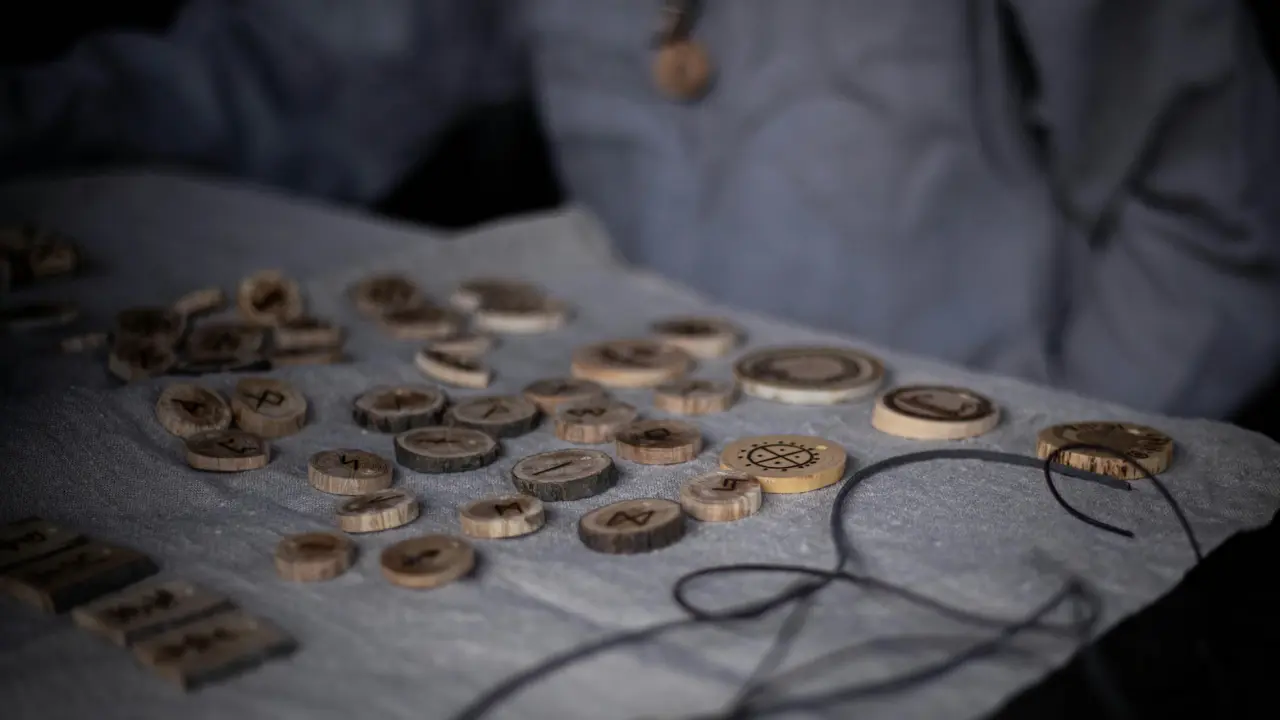 Runic diviner interpreting rune casts